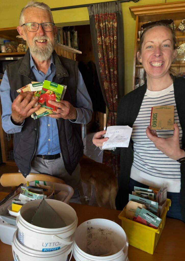 Rachael and David sorting seeds on the Tanglewood farm